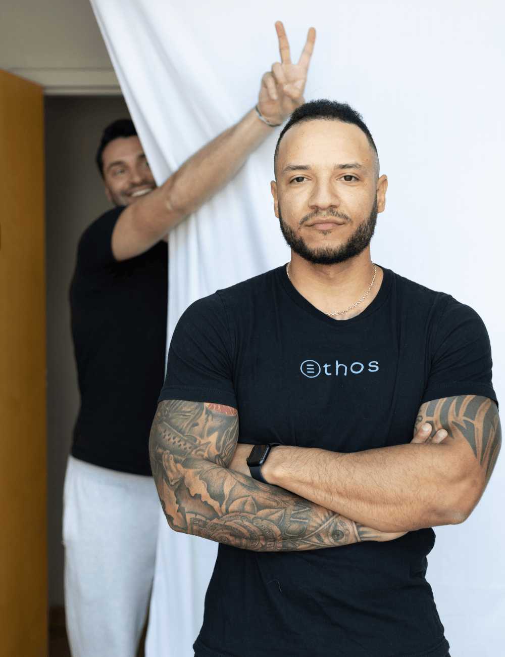 Two guys, the partners of The Ethos Team, posing for a picture.