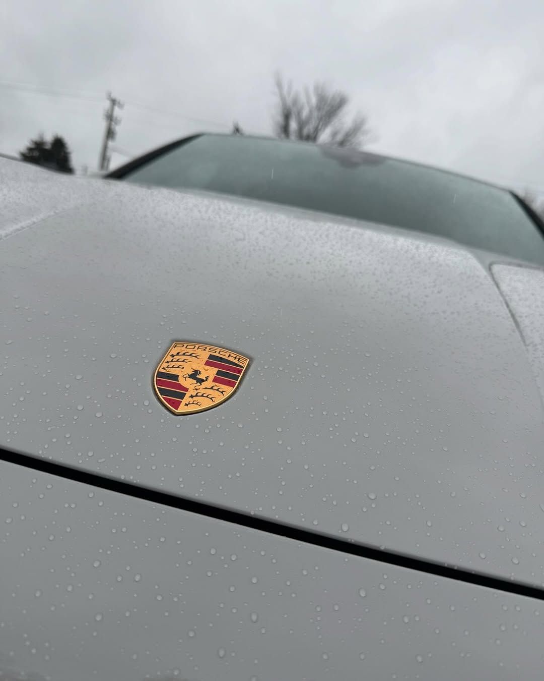The front of a Cayenne wrapped Porsche.
