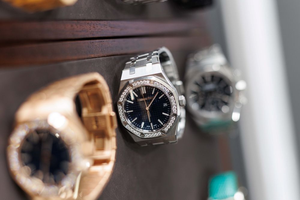 Three watches laying on display.