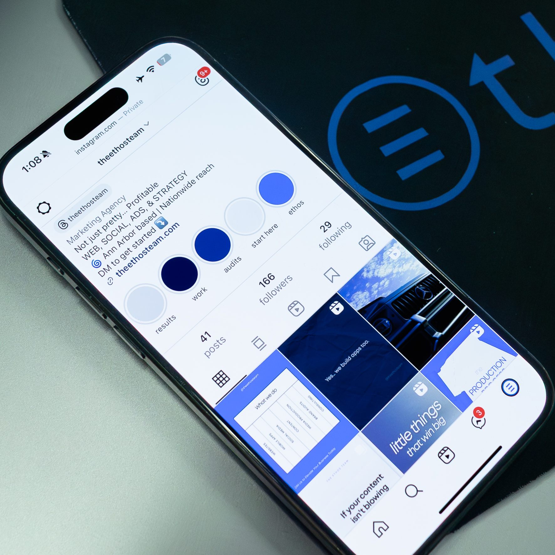 Instagram profile screen on modern smartphone with blue and white interface