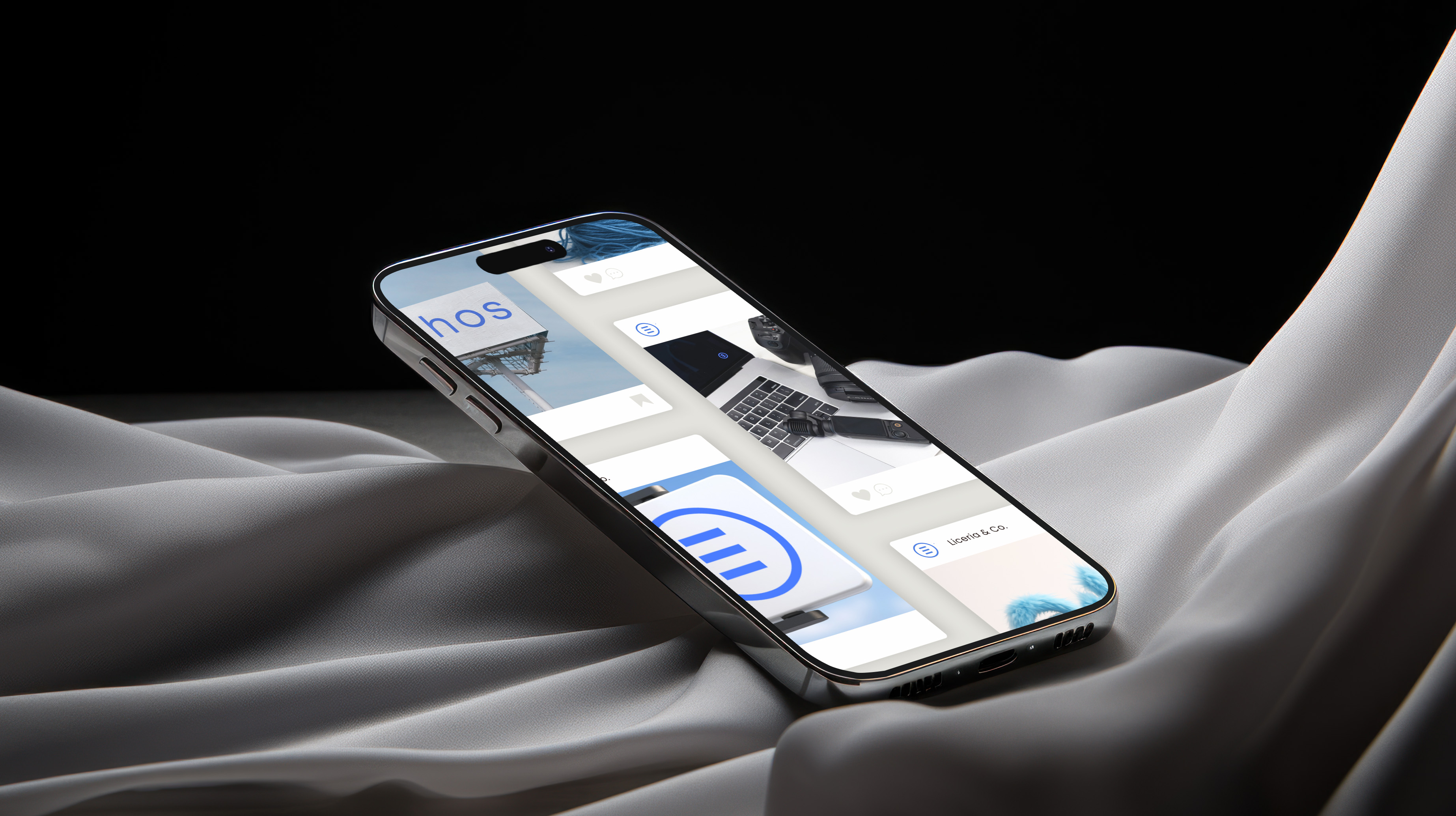 Modern smartphone displaying multiple app screens on soft gray fabric