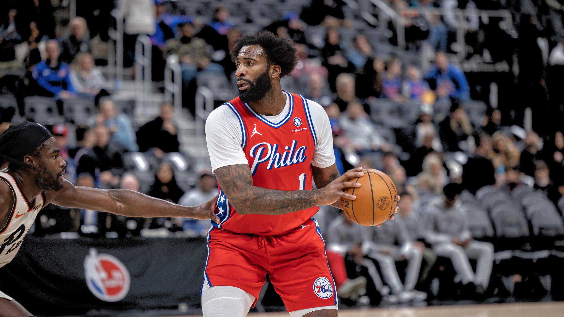 Philadelphia 76ers player holding basketball during NBA game