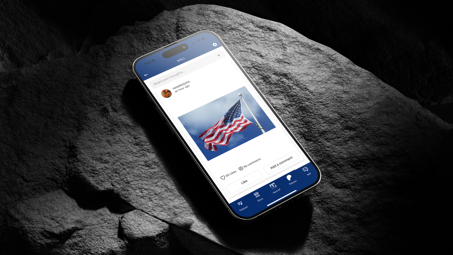 Smartphone displaying social media post with waving American flag