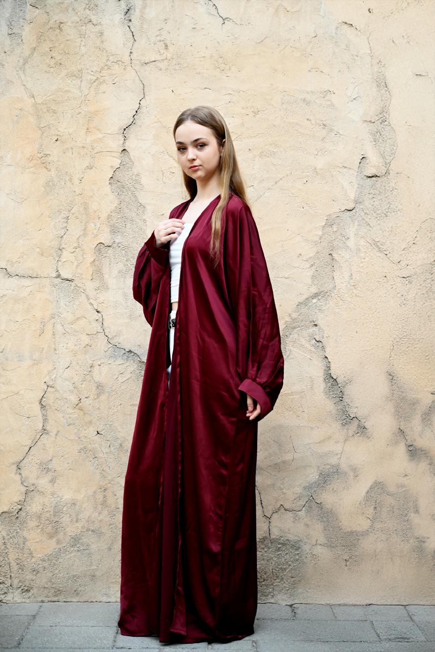 An elegant and airy free-sized abaya, the Maroona is crafted in delicate chiffon that flows gracefully with every movement. Its lightweight drape offers both modesty and modern finesse—perfect for layering and styling across seasons.