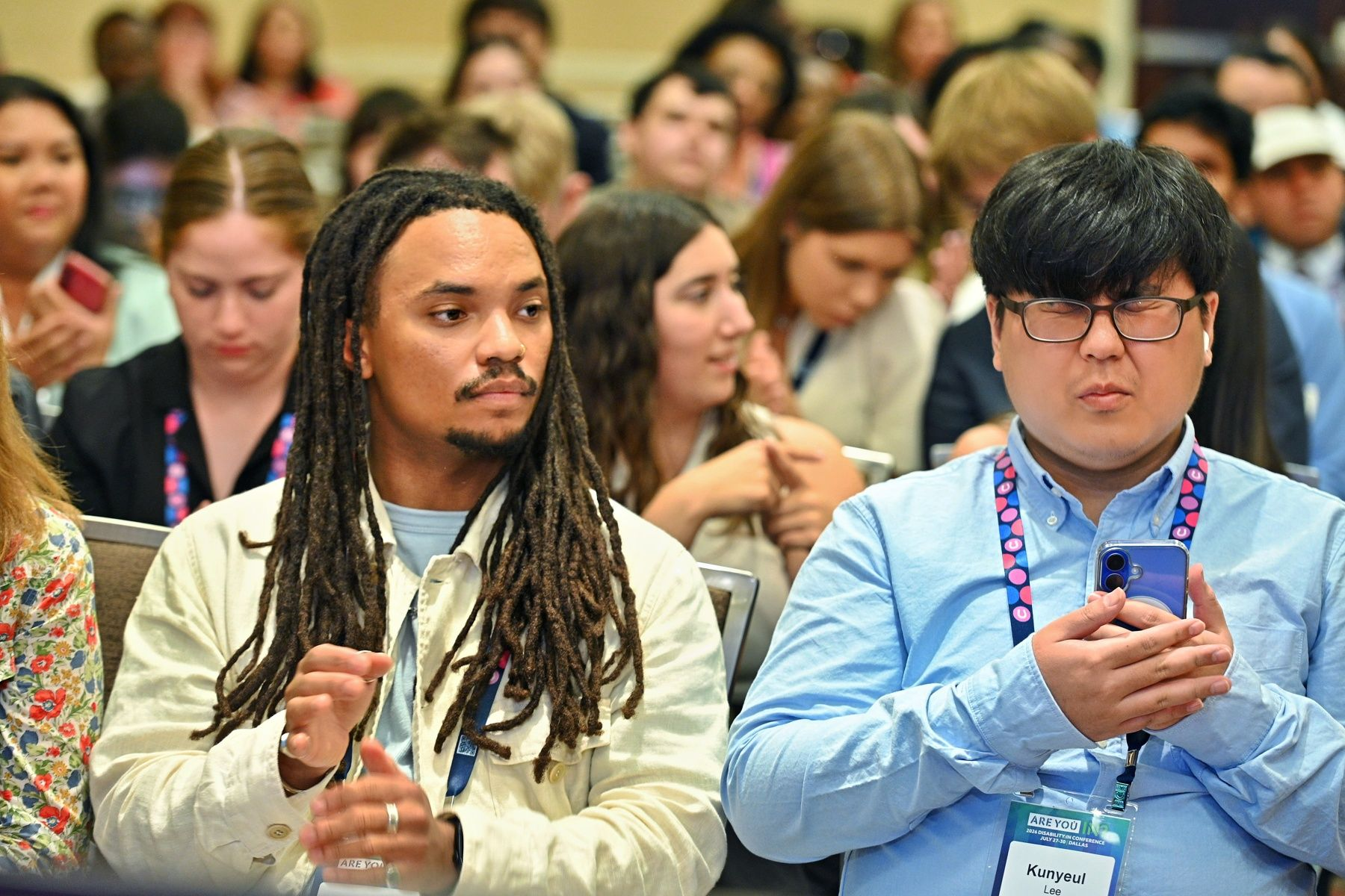 Miles and his fellow NextGen leader sit beside each other during a development session.