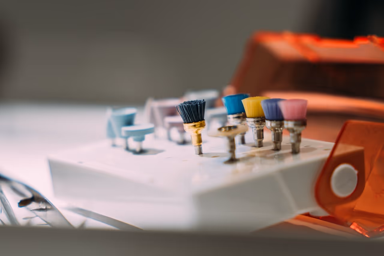 Tray of coloured prophy polishing cups used for teeth cleaning