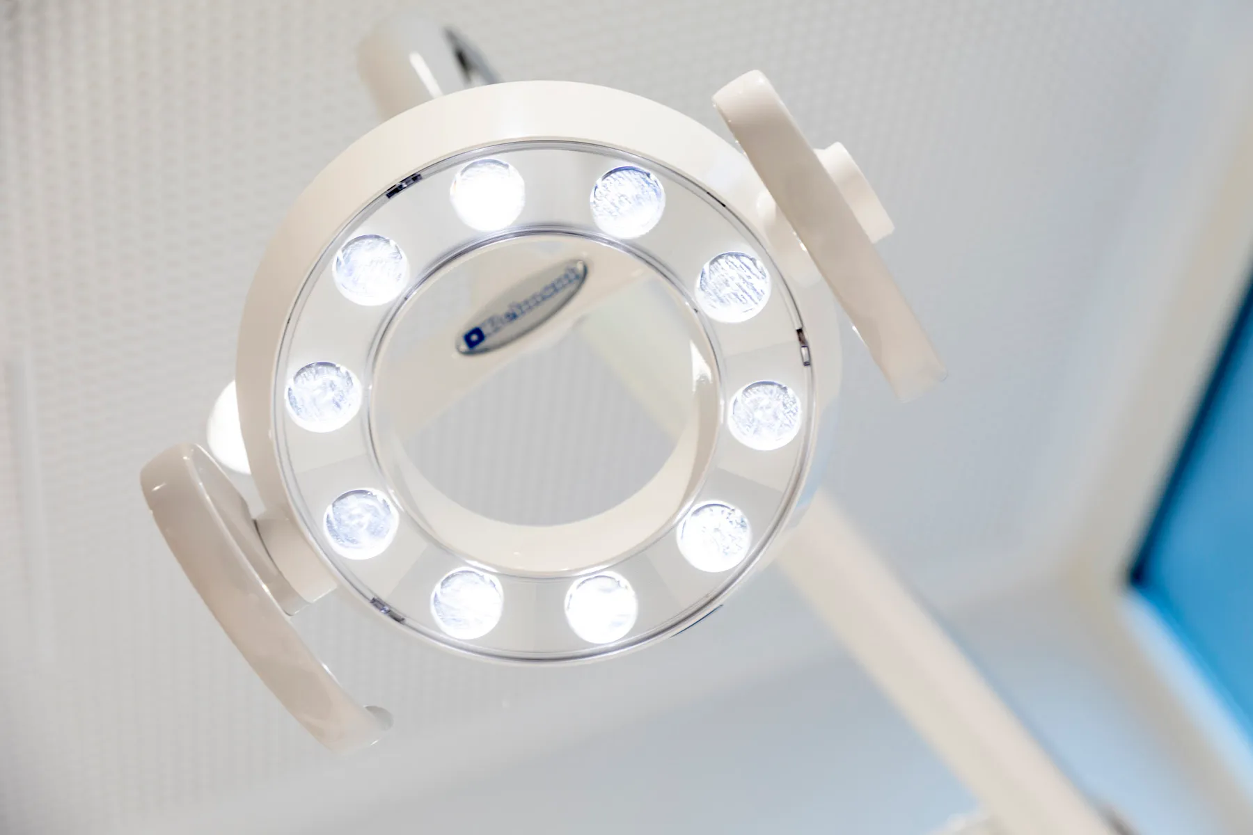 Overhead LED dental examination light in a treatment room at Maida Smiles dental clinic