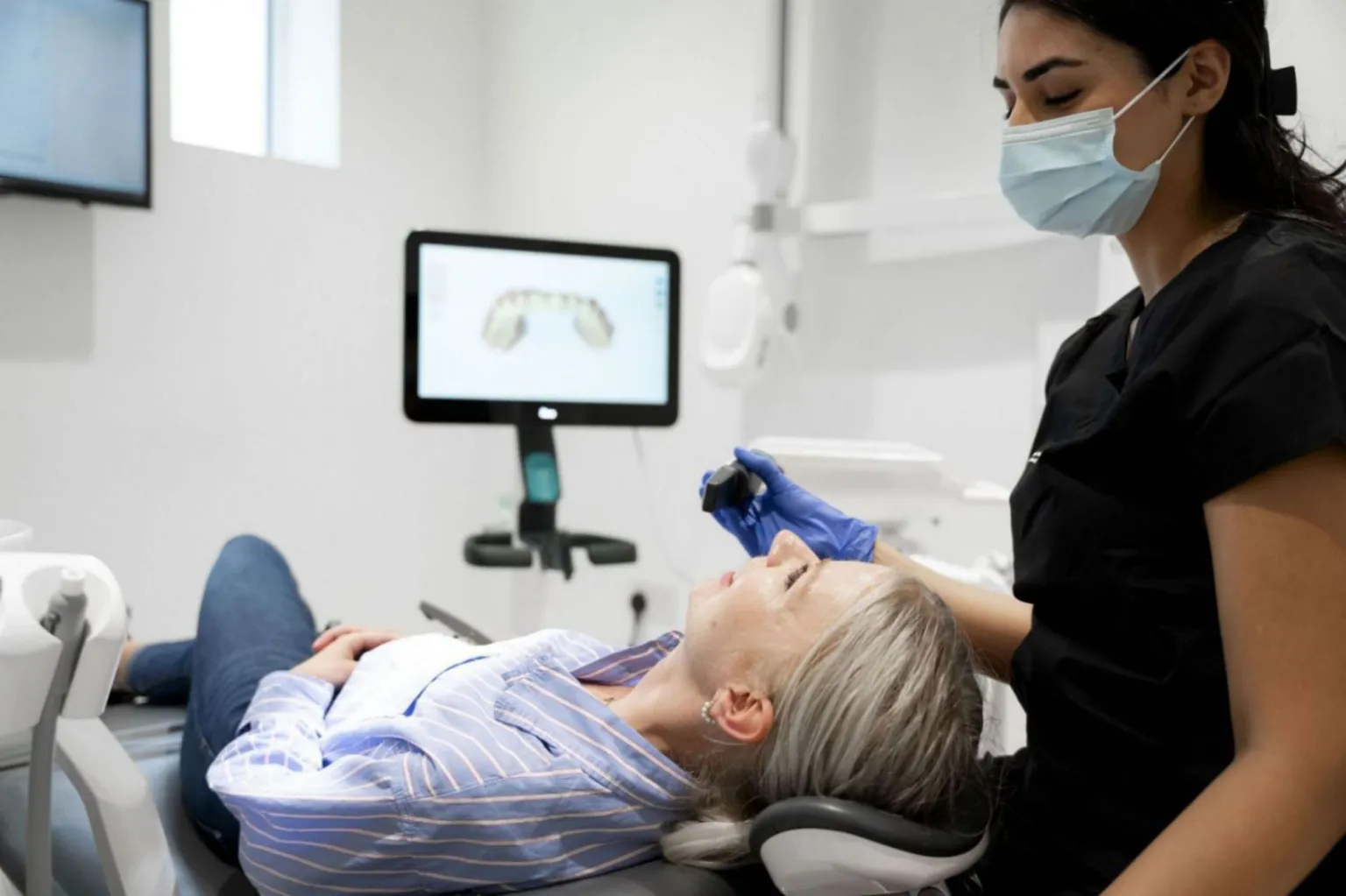 Dental consultation in progress at Maida Smiles
