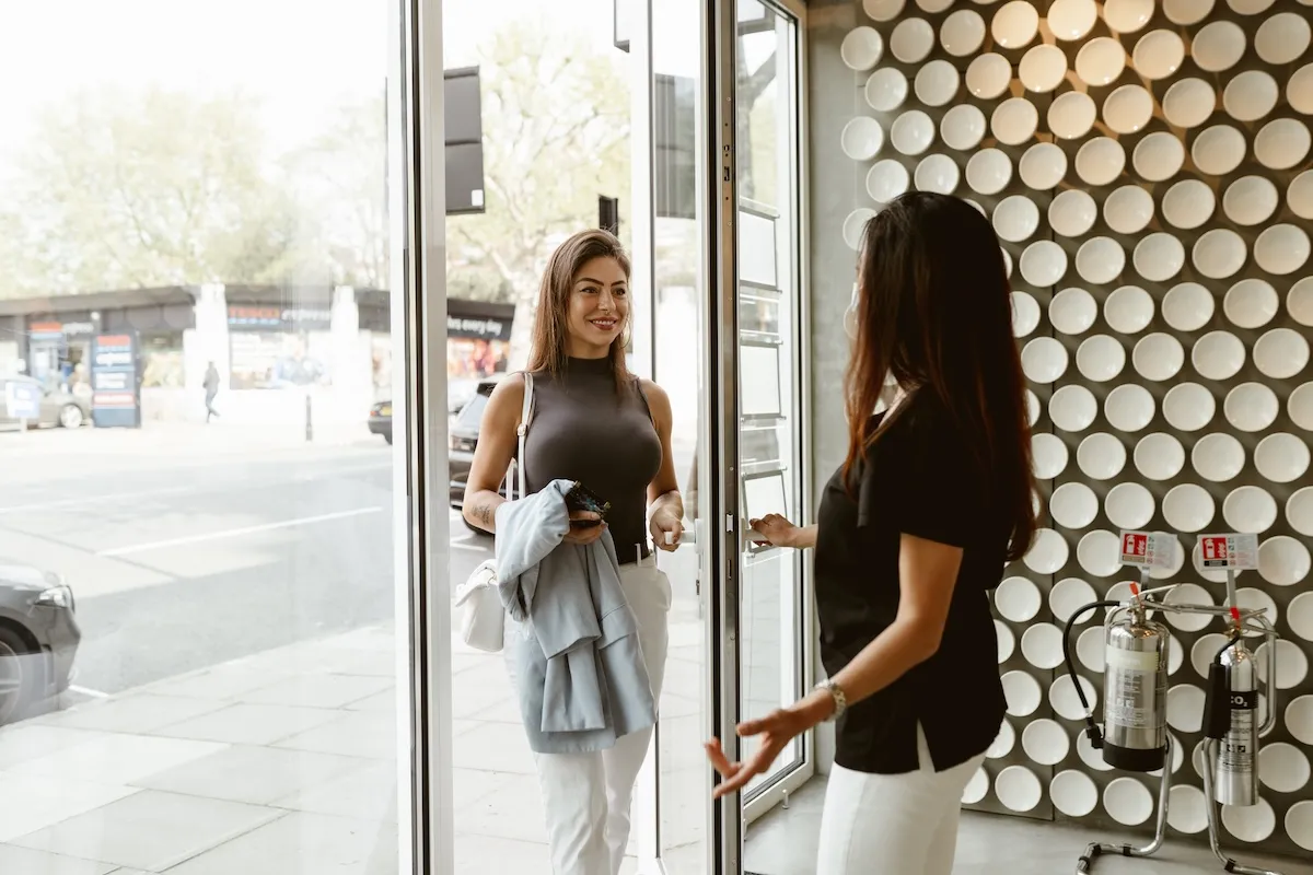 Patient being welcomed at the Maida Smiles entrance