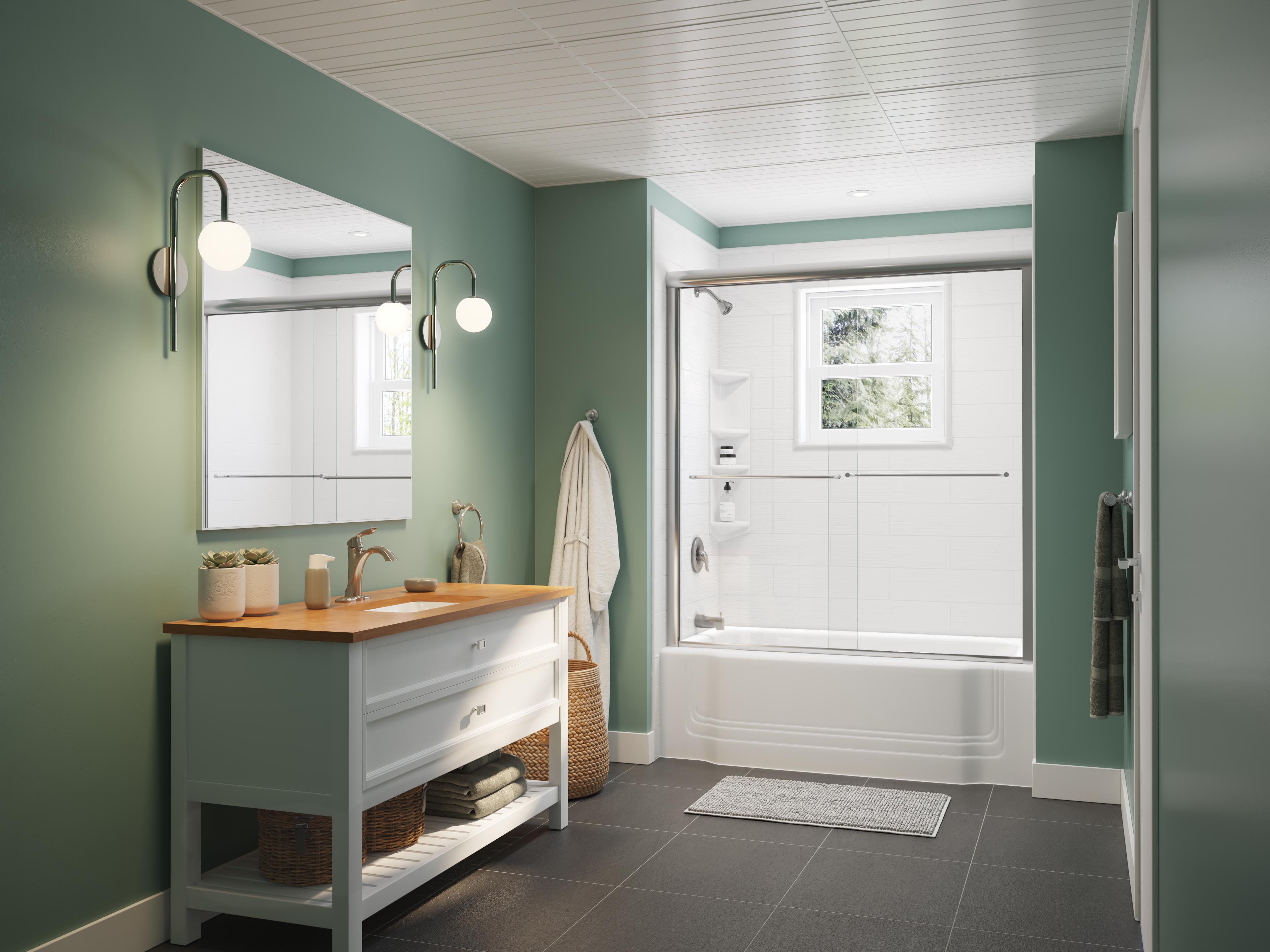 Contemporary bathroom with green walls, wood-top vanity, round wall lights, and a white tub-shower combo with sliding glass doors and a window above.