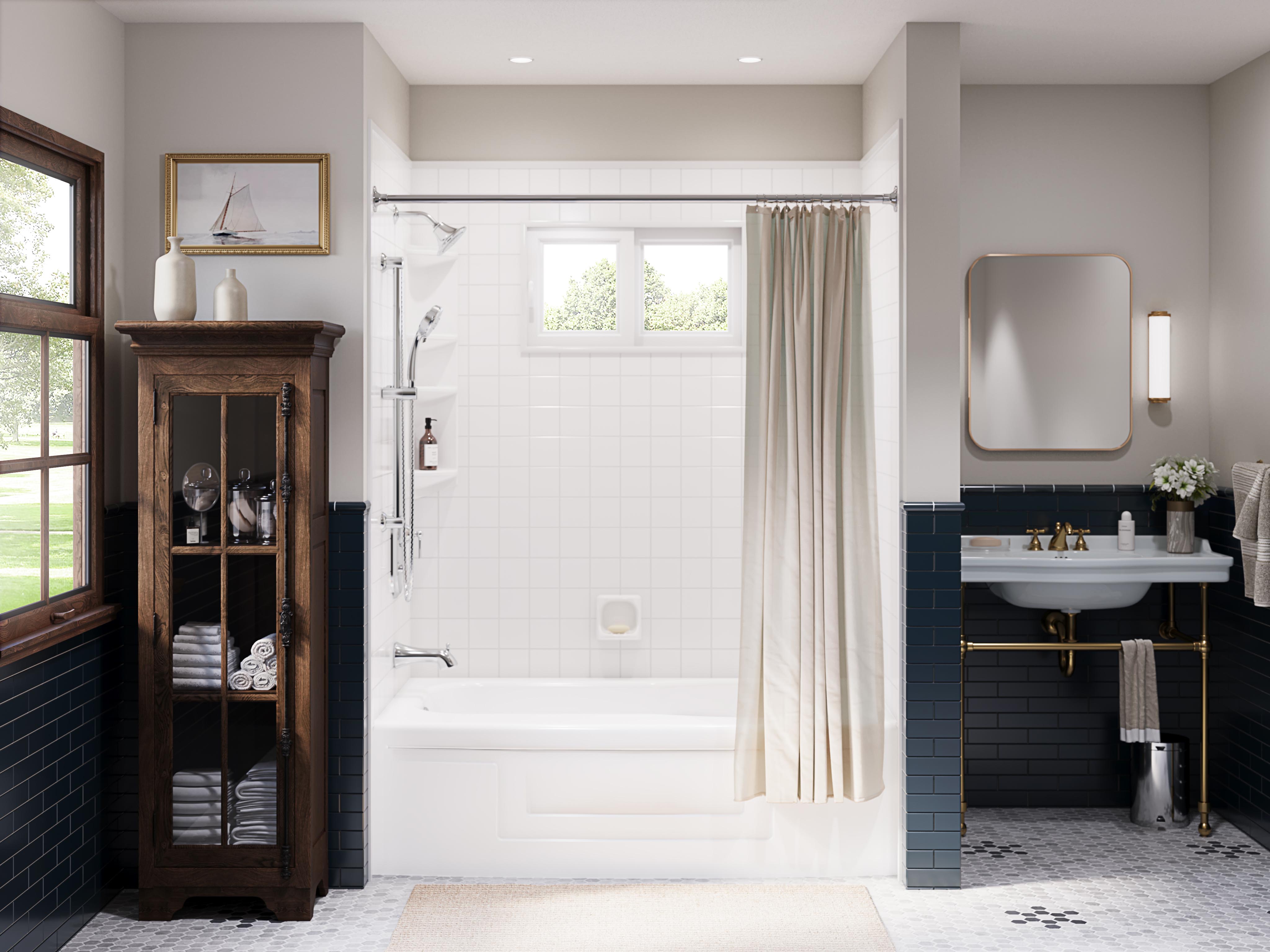 Elegant bathroom with a white tub-shower combination, beige shower curtain, and white tile walls. Features include a vintage wooden cabinet with towels, a white sink with gold fixtures, a large window, and navy blue tiled wainscoting.
