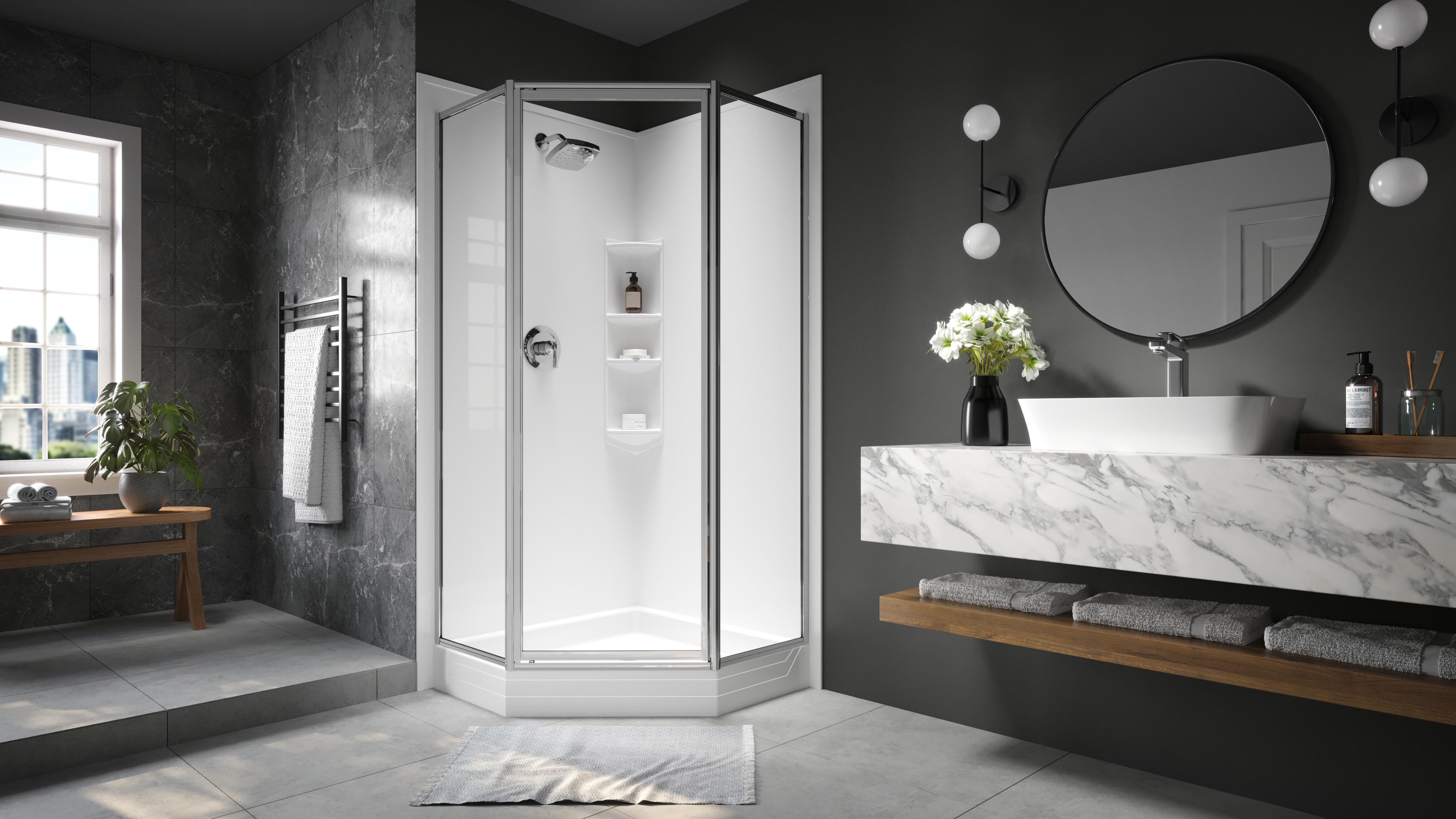 Modern bathroom with a sleek, angular glass shower enclosure, surrounded by dark gray marble and matte charcoal walls. Features include a round mirror, marble vanity with vessel sink, wall-mounted lights, and minimalist wooden shelving with rolled towels and fresh flowers.
