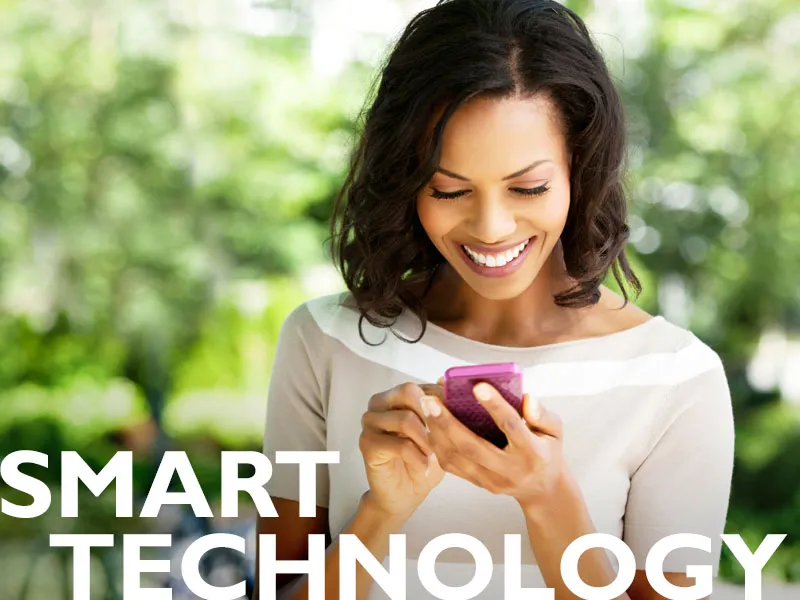 Woman using her cell phone - smart technology