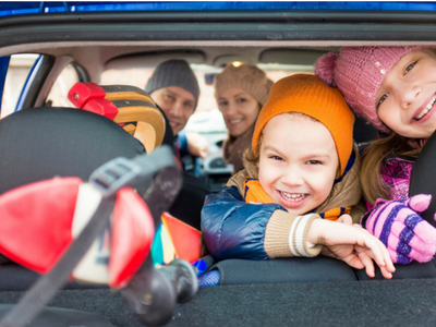 a happy family in the car