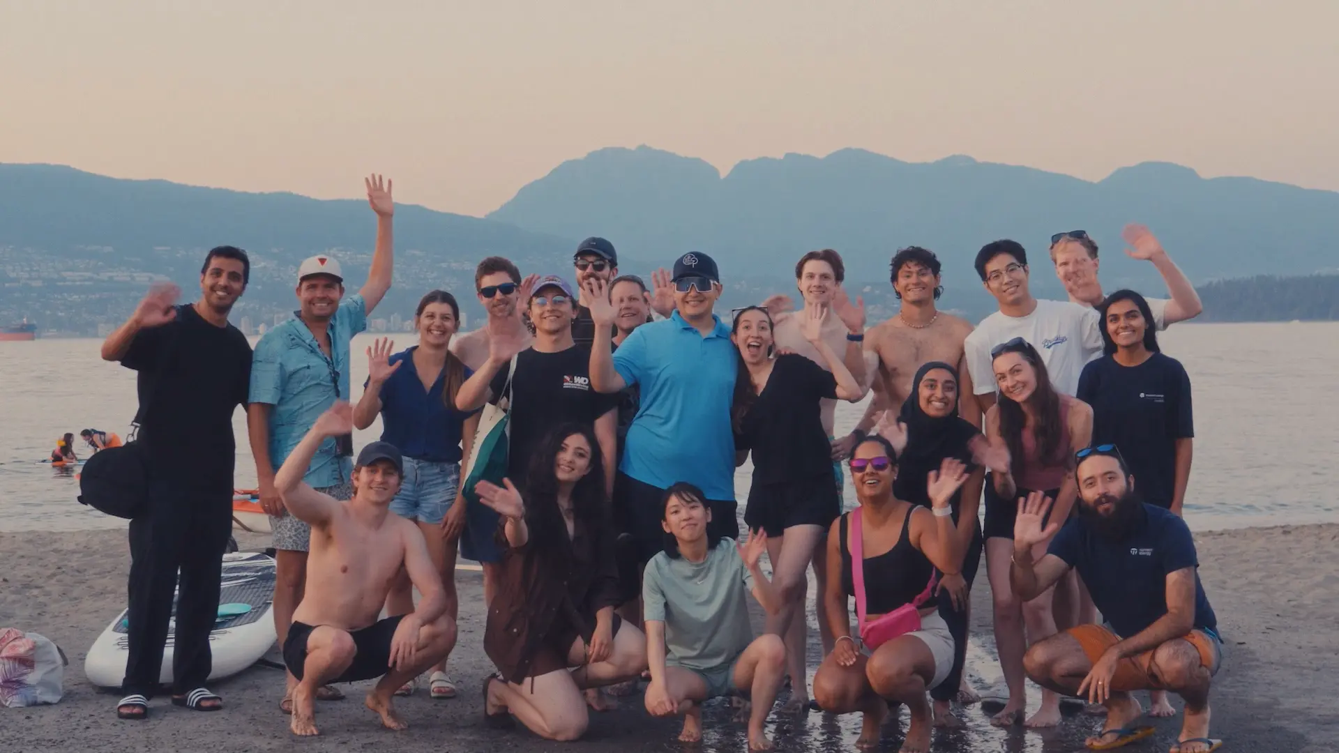 Team picture of Moment Energy employees at a beach.