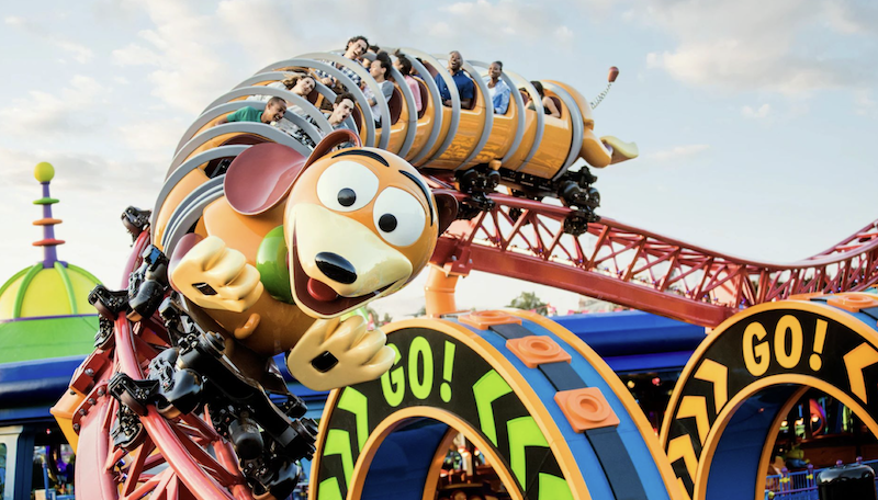 Slinky Dog Dash roller coaster in Toy Story Land with riders twisting through colorful track at Disney World