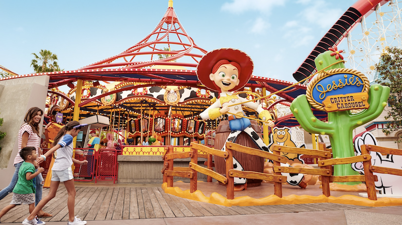 Jessie’s Critter Carousel at Pixar Pier with bright colors, carousel ride, and guests enjoying Toy Story attraction