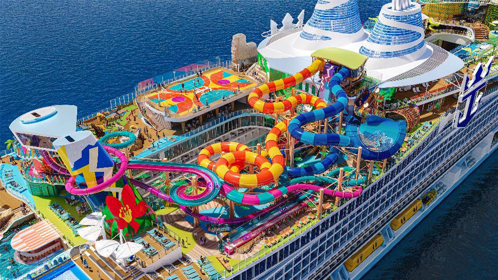 Aerial artist's rendering of Royal Caribbean's Hero of the Seas featuring colorful waterslides, a basketball court, and resort-style decks at sea.