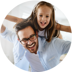 Father with his young daughter sitting on his shoulders