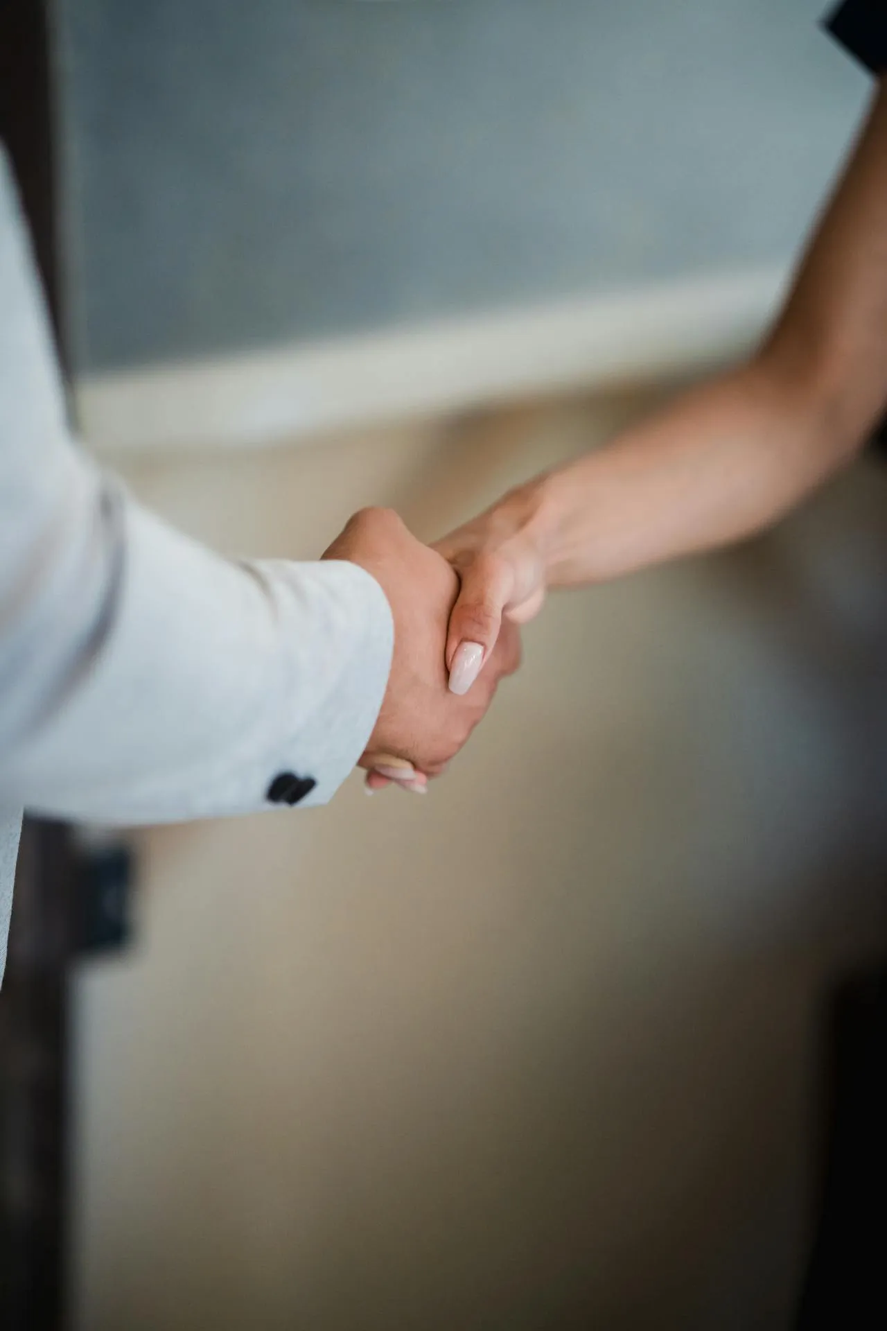 People shaking hands. Together Under One Roof is a great local networking event for local home industry professionals within the community in Mandeville
