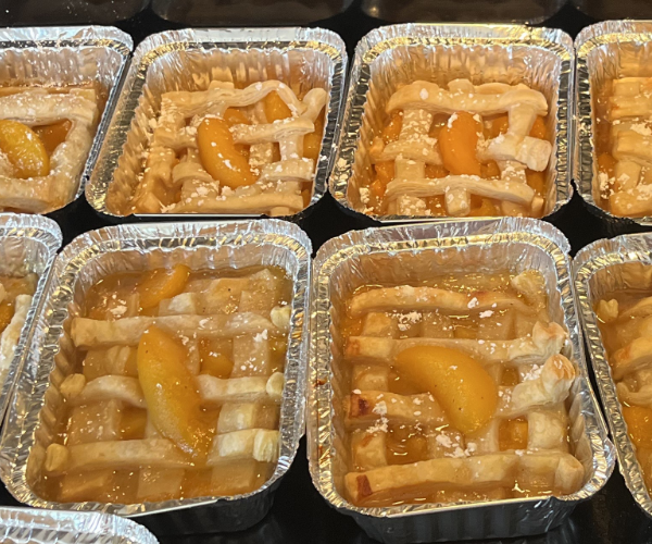 An image of multiple peach cobblers.
