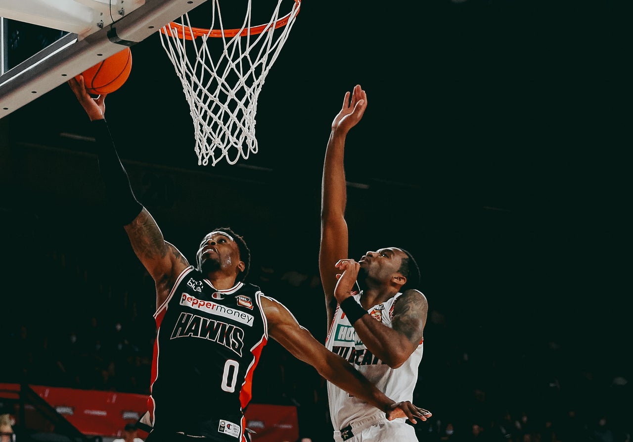 Second half surge helps Wildcats clip Hawks' wings