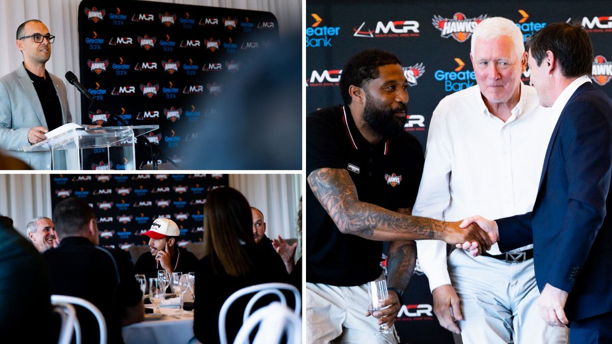 Aaron Anderson, General Manager Commercial at the Illawarra Hawks, speaks at a lectern; Tyler Harvey laughs with guests at a table; Justin Tatum shakes hands with Paul Juergens as Chuck Harmison looks on, in front of a Greater Bank, MCR and Hawks backdrop