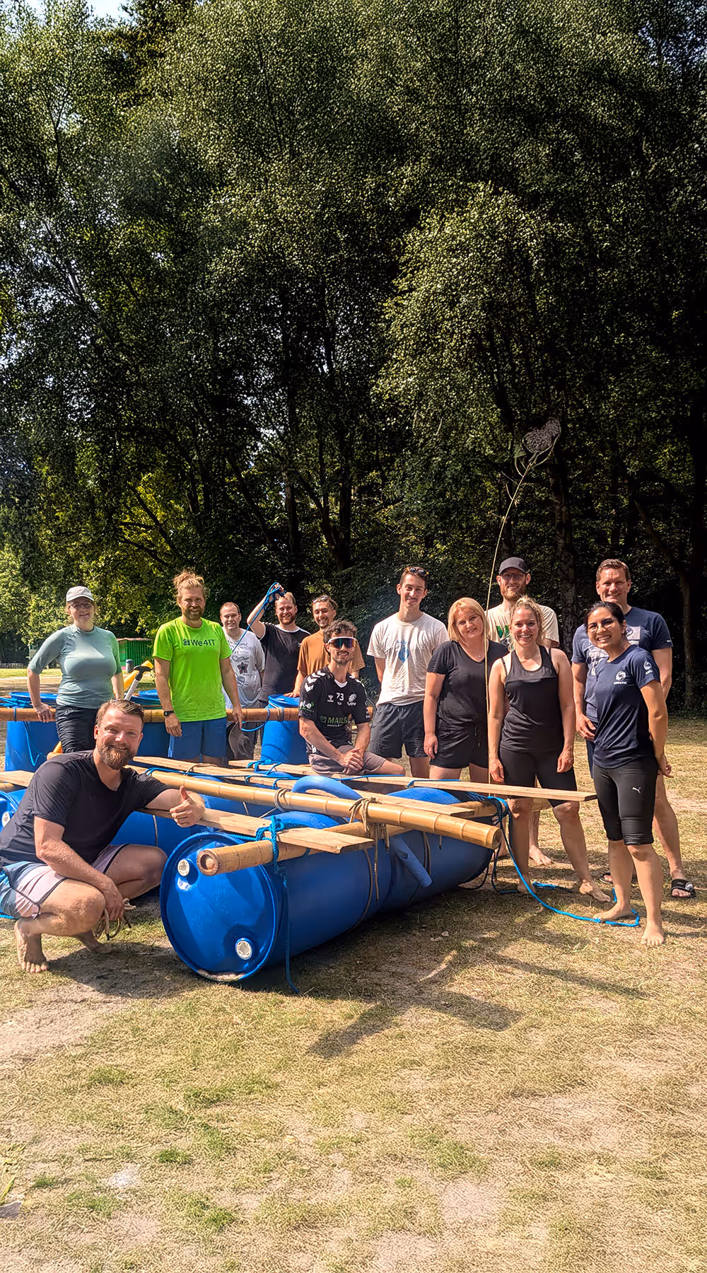 Employer Event building a floating boat with all axontic staff in the summer on the beach