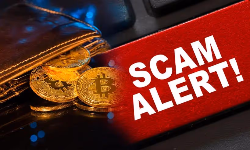 A warning sign reading “Scam Alert” appears next to Bitcoin coins, highlighting rising Social Media Scams involving fake crypto investments and digital wallet fraud..