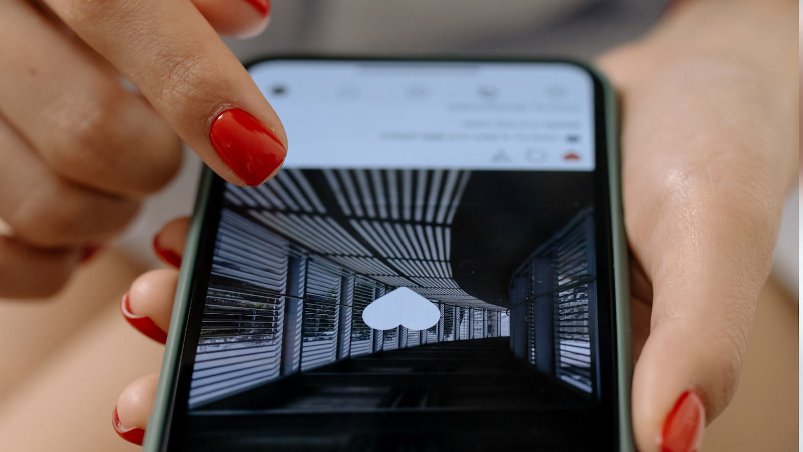 A business owner engages with content on Instagram by liking a post