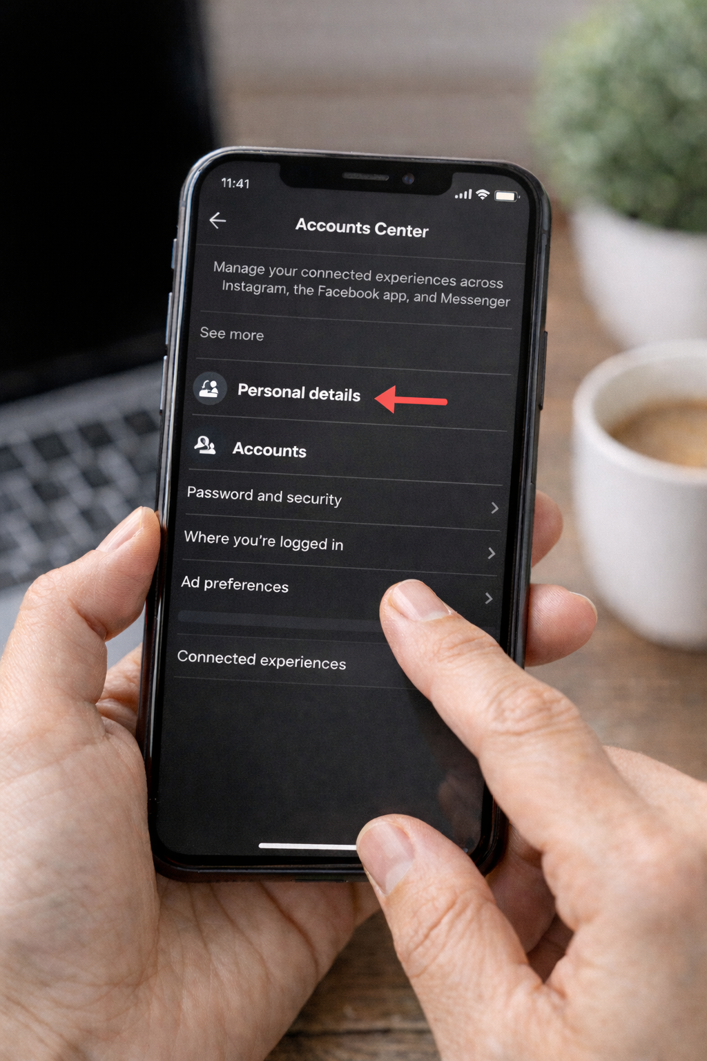 Smartphone showing Instagram Accounts Center settings screen with a red arrow pointing to “Personal details” option in the menu.