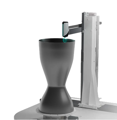 metal rocket nozzle mounted on a rotating platform on a gantry type 3d printing system