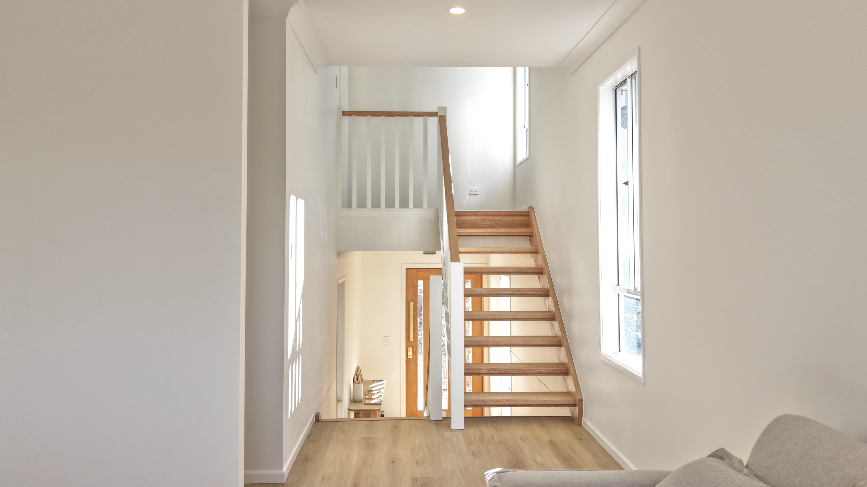 Split-level home interior with a staircase, built on a sloping block in Brisbane