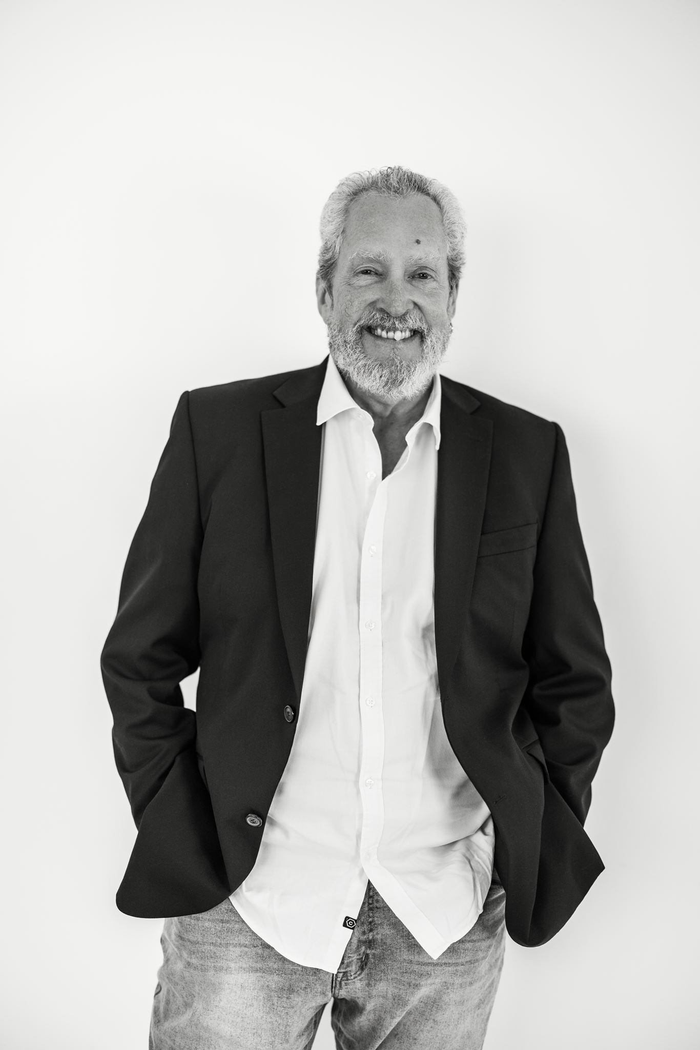 Little Funeral Company director Andrew smiling in a suit jacket in Northern Beaches NSW