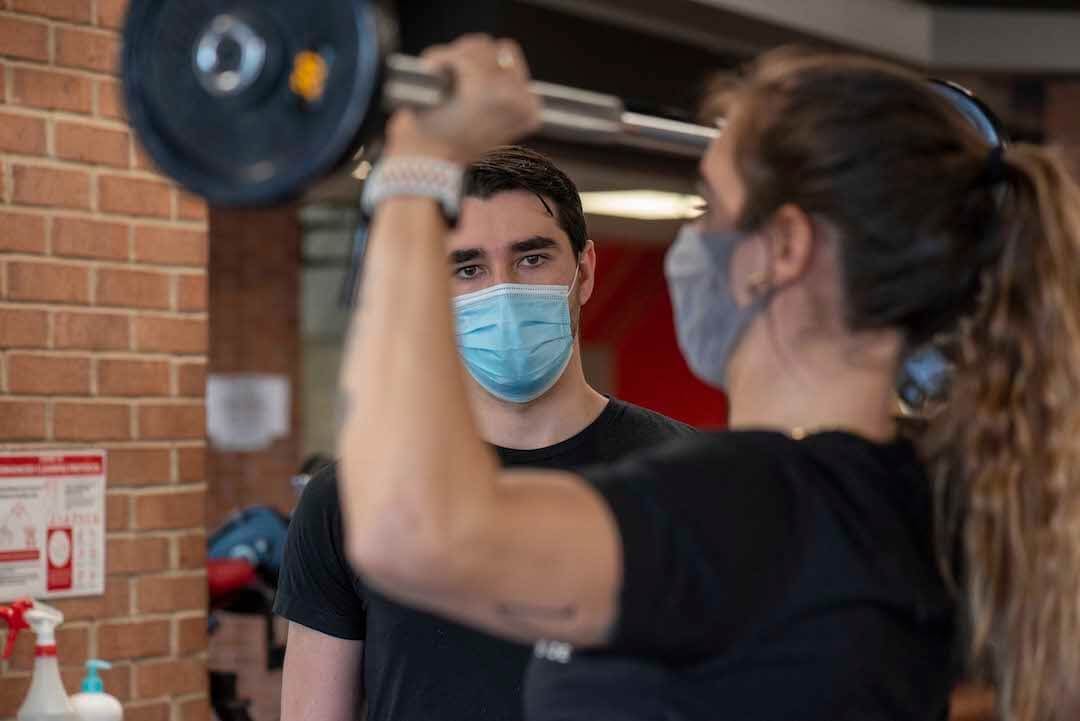 gym personal training wearing masks barbell