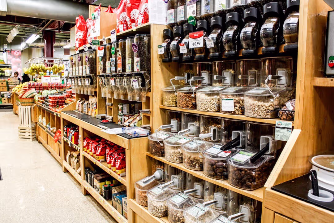 bulk goods nuts berries grocery store coop sustainable products shopping wooden displays