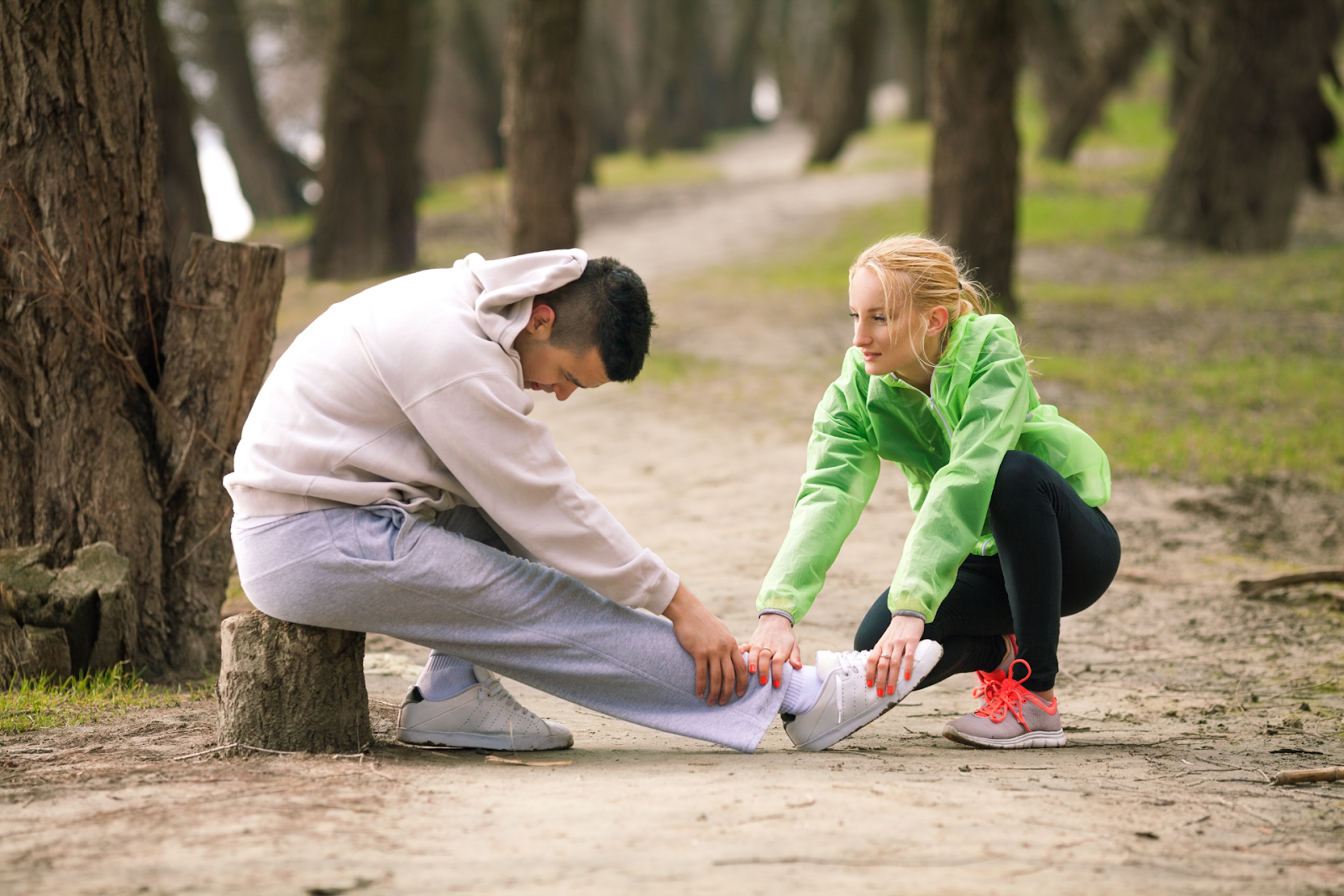 woman helping injured teammate