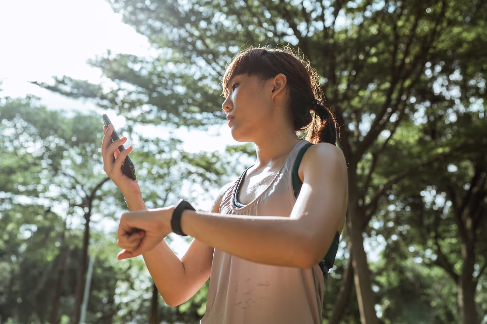 woman outside checking watch