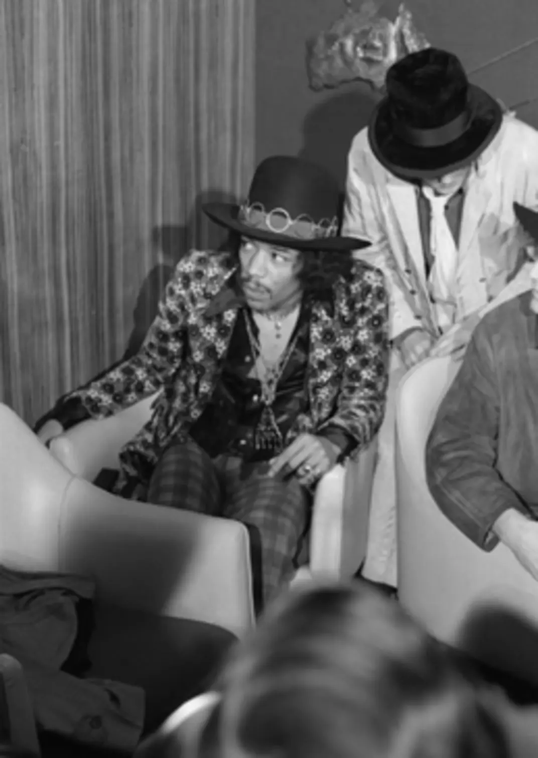 Jimi Hendrix in a puffy blouse, waistcoat and Western belt