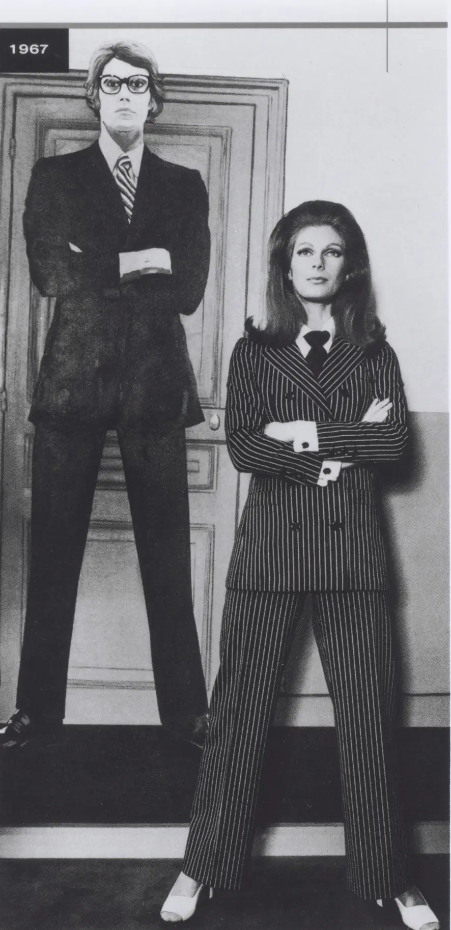Baroness Thyssen (Fiona Campbell-Walter) wears pin-striped pantsuit from Yves Saint Laurent