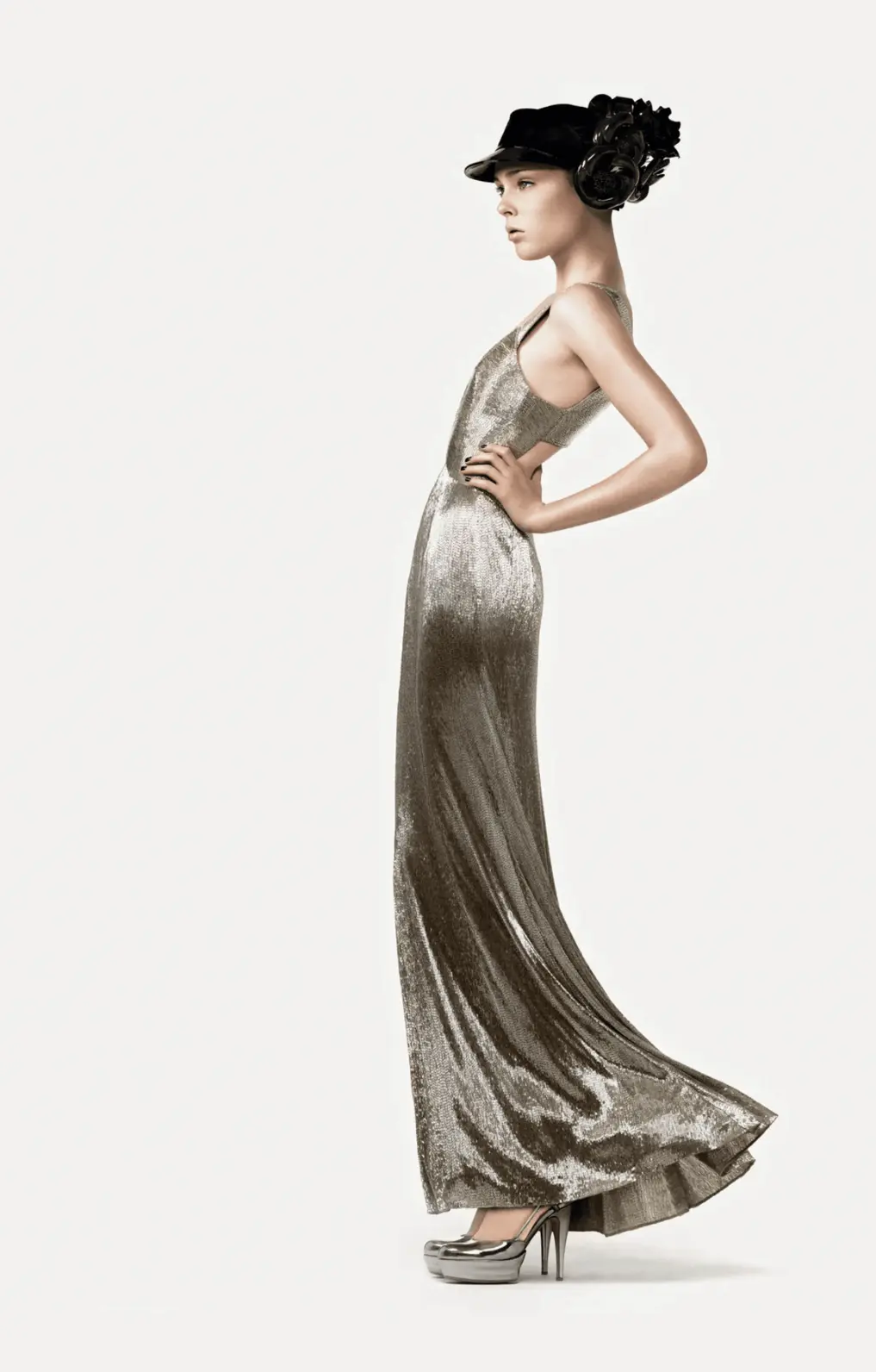 Coco Rocha models Giorgio Armani’s platinum beaded gown, channeling retro-Hollywood glamour, in Vogue, March 2007