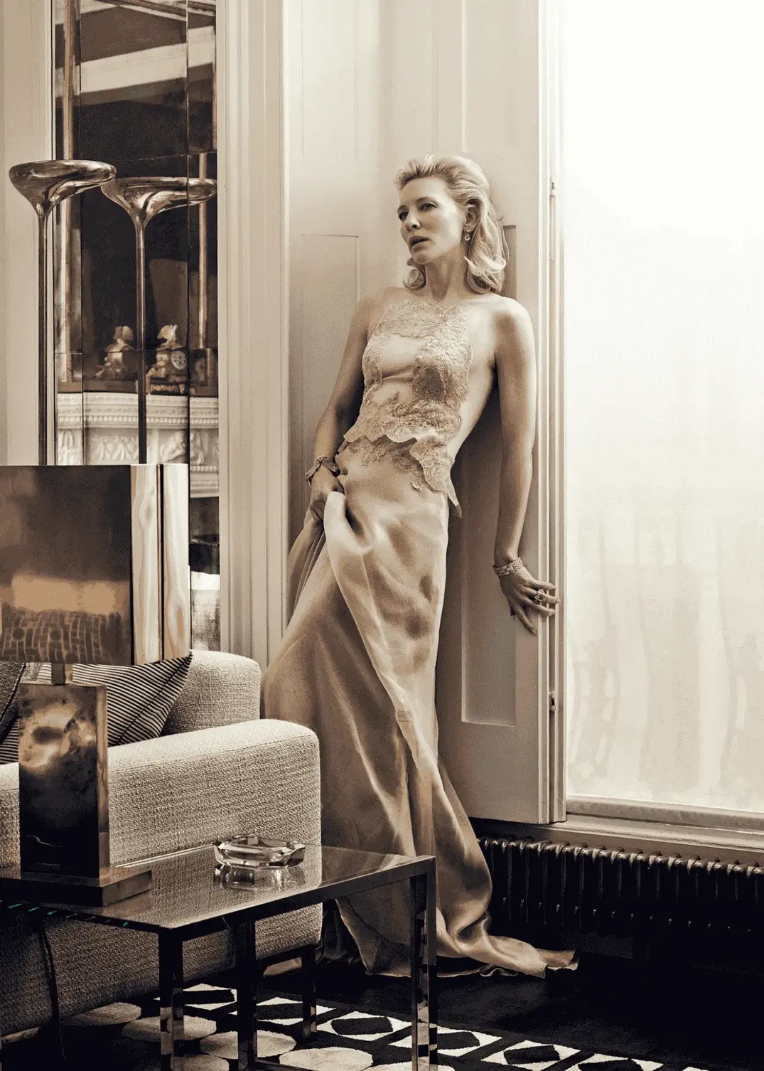 Armani loyalist Cate Blanchett wears an Armani Privé silk dress, featuring lace and tulle appliqué, in the January 2014 issue of Vogue