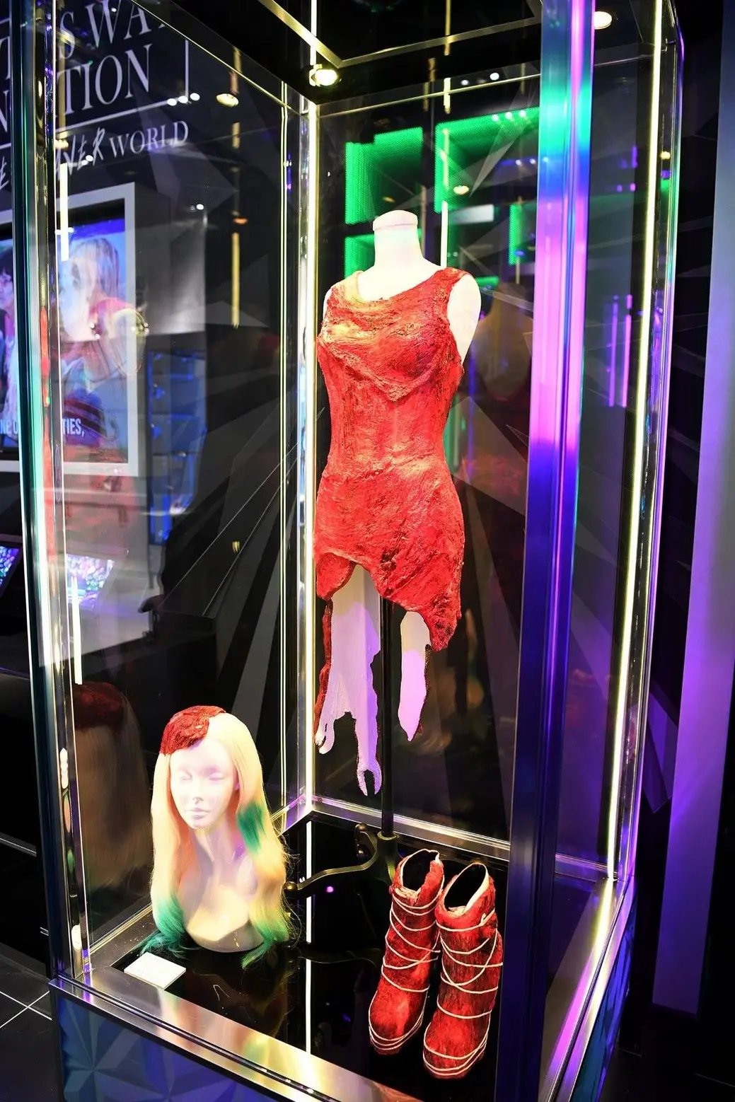 The meat dress, wig, and boots on display at the Haus of Gaga