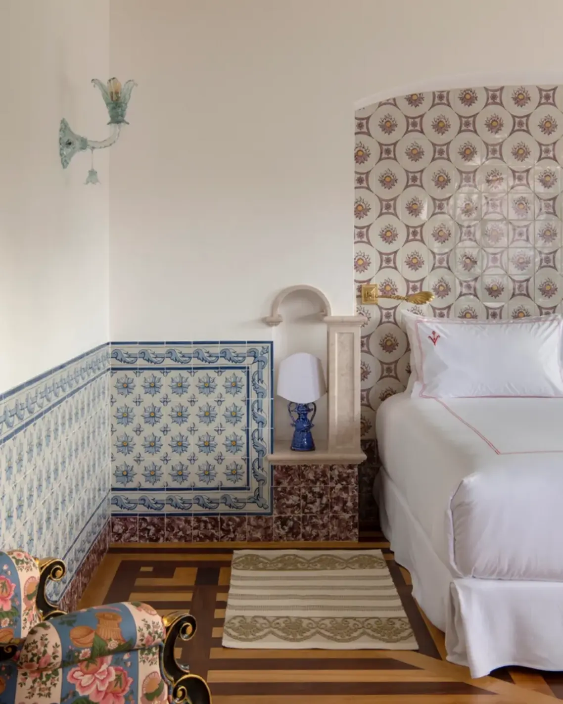Hotel Vermelho boutique hotels Europe Glazed tiles from Azulejos de Azeitão form a headboard in one of the first-floor bedrooms