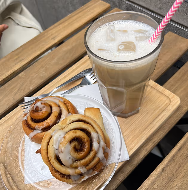 vegan cinnamon rolls on plate and chai latte