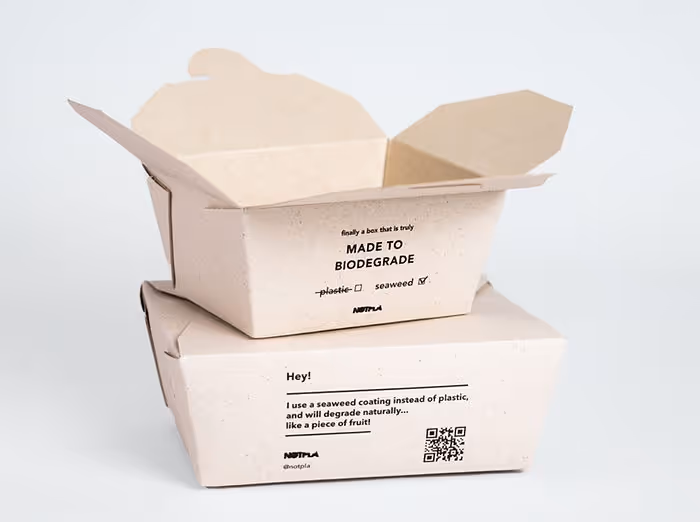 two takeaway boxes stacked on one another