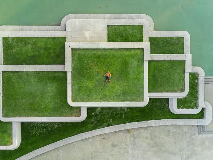 modern stone building with green rooftop
