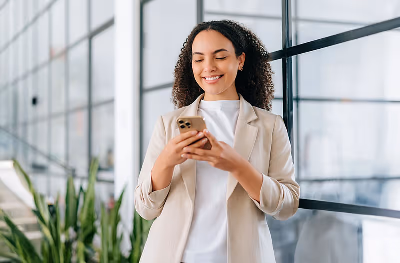 A young woman using her iPhone