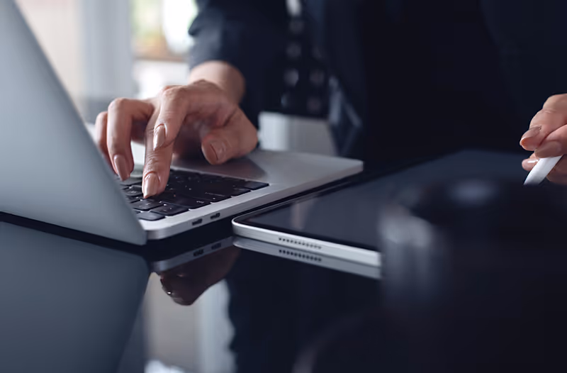A young woman using her iPhone