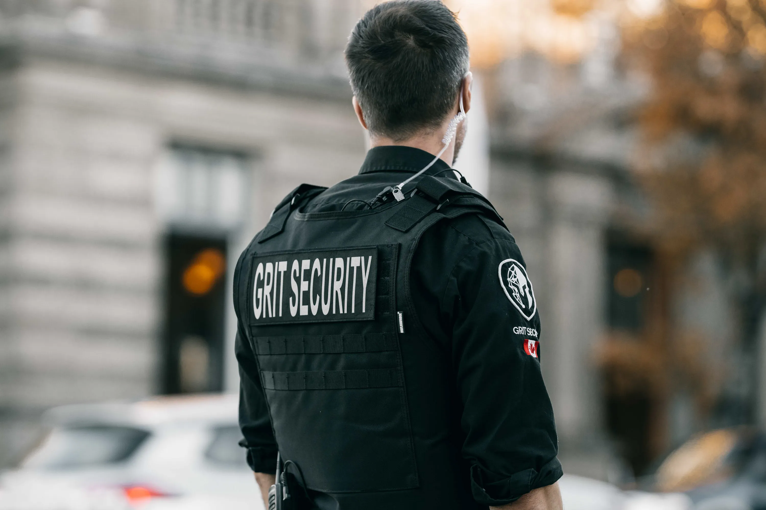 A security officer standing in front of a building.